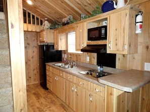 Fridge, stovetop, coffee/tea maker, electric kettle