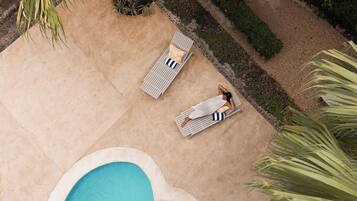 2 outdoor pools, open 7:00 AM to 6:00 PM, pool loungers