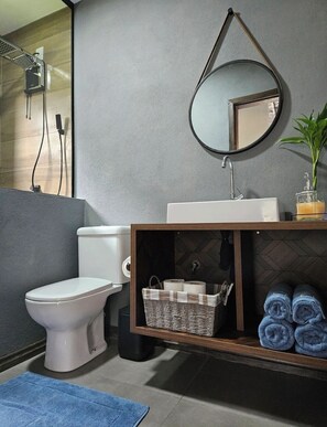 Shower, towels, soap, toilet paper