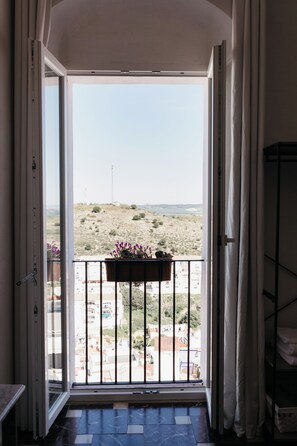 Double Room, Balcony, City View | In-room safe, blackout curtains, iron/ironing board, free WiFi