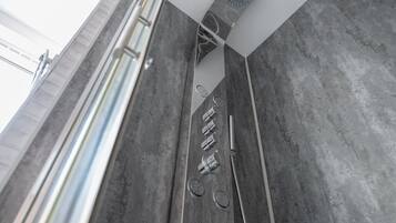 Shower, jetted bath, towels, soap