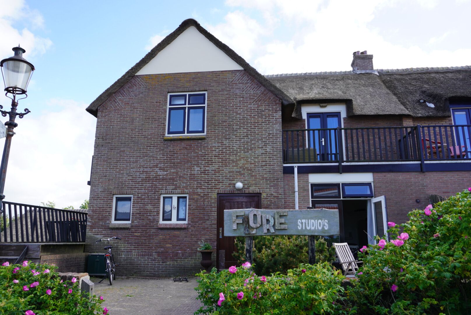 A two-story building with a sign reading "FORE STUDIO'S" at the entrance.
