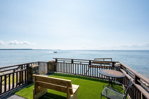 Sister Bay waterfront cabin surrounded by nature with kayaks, boathouse deck, and game room