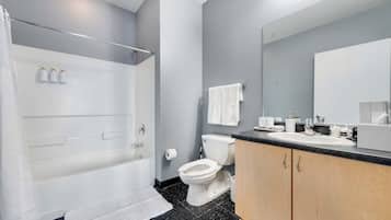 Shower, hair dryer, towels, shampoo