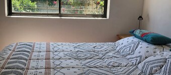 Independent furnished cabin with terrace and grill, steps from Playa Negra.