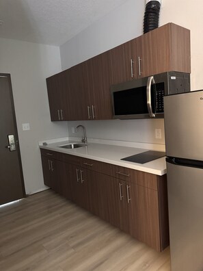 Fridge, microwave, stovetop, coffee/tea maker