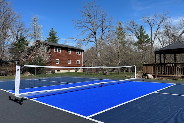 Regulation size pickleball court with Sport Court surface is only shared with guests who book the Guest Quarters.