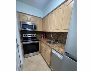 Apartamento familiar, vistas al mar | Cocina privada