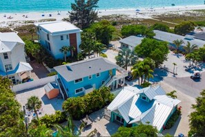 A coastal hotel with multiple buildings, a beach view, and a pool area. - Private Pool / Spa Home - Steps to Anna Maria Island Beach (Anna Maria)
