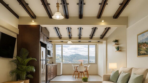 A modern living room with a sofa, a dining table, and a kitchen area with a large window.