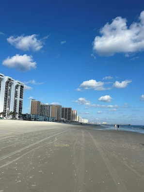 A beach with a row of high-rise buildings in the background. - Oceanfront Shore Drive. Steps to Sand. King Suite + Balcony Views. APATBIII (Myrtle Beach)