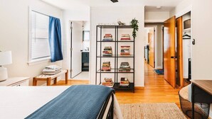 A bedroom with a bed, a bookshelf, a desk, and a ceiling fan. - Central, Stylish 3/2 Family Home + Great Amenities (Danville)