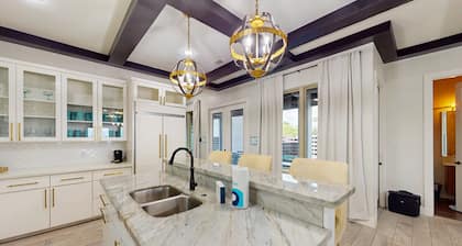 Stunning waterfront home with private pool, gym, & grill - steps to sand & SPI