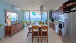 Fridge, stovetop, dishwasher, coffee/tea maker