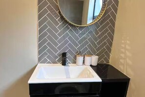 Shower, towels, soap, toilet paper