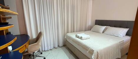 Apartment | Desk, laptop workspace, blackout drapes, iron/ironing board