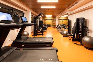 A gym with treadmills, weight machines, and exercise balls. - Ananti Resort & Spa (Trikala)