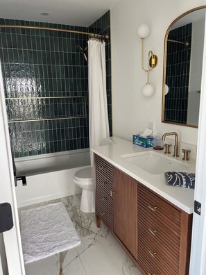 Shower, towels, soap, toilet paper