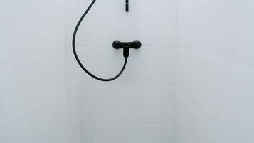 Shower, eco-friendly toiletries, hair dryer, towels