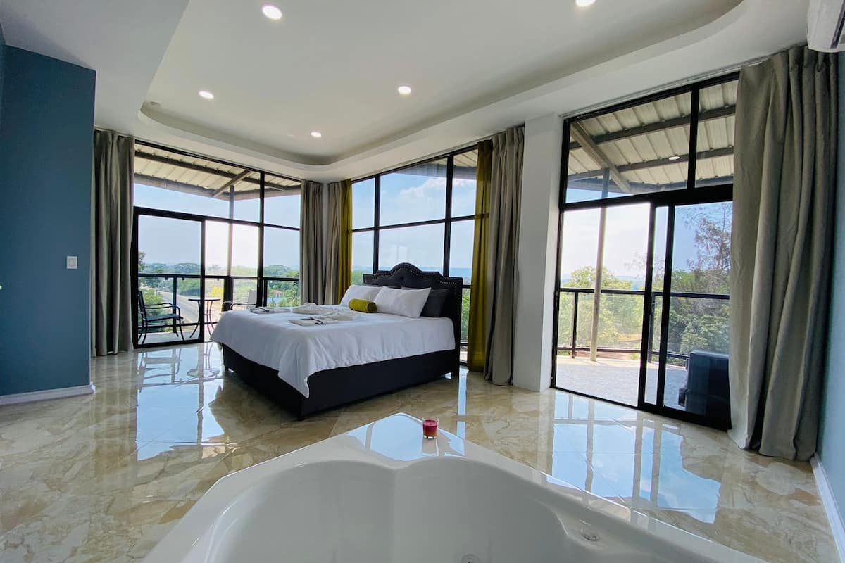 Deluxe Suite, Balcony | In-room safe, laptop workspace, blackout drapes, iron/ironing board