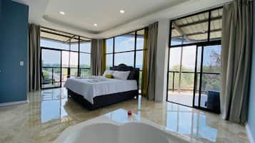 Deluxe Suite, Balcony | In-room safe, laptop workspace, blackout curtains, iron/ironing board