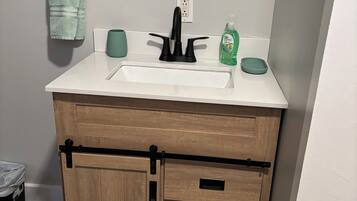 Hair dryer, towels, soap, toilet paper