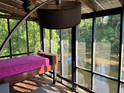 Cabin on secluded horse farm with stocked pond.