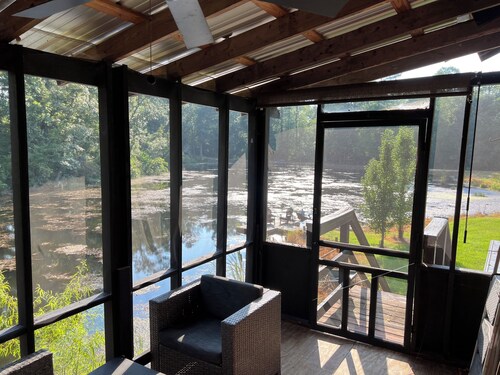 Cabin on secluded horse farm with stocked pond.
