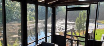 Cabin on secluded horse farm with stocked pond.