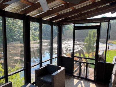 Cabin on secluded horse farm with stocked pond.