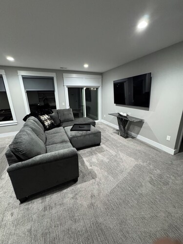 Contemporary & spacious 5-bedroom home with pool table & foosball in Urbandale!