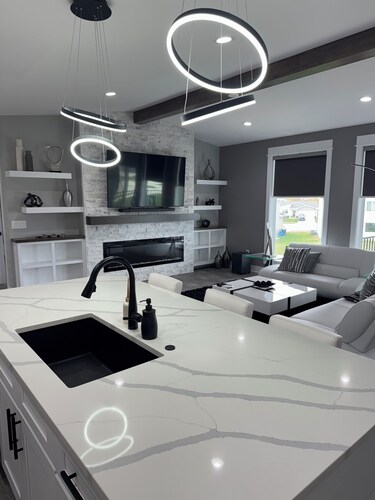 Contemporary & spacious 5-bedroom home with pool table & foosball in Urbandale!