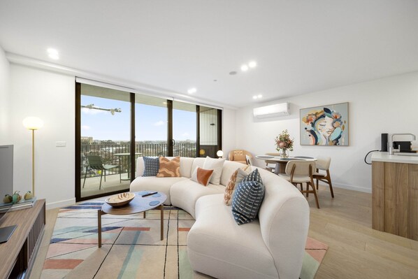 Living area - Sleek Inner-city 2-bed With Swimming Pool & BBQ (Canberra)