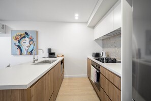 Apartment | Private kitchen - Sleek Inner-city 2-bed With Swimming Pool & BBQ (Canberra)