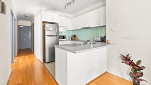 Apartment | Private kitchen | Highchair, cookware/dishes/utensils - Lovely 2-bed With Balcony (Sydney)