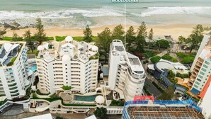 A high-rise hotel with multiple balconies overlooking a beach. - Stylish 3BR Oceanfront Stay by Mooloolaba Esp (Sunshine Coast)