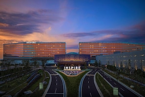 A modern building complex with the name 'INSPIRE' prominently displayed. - Inspire Entertainment Resort (Incheon)