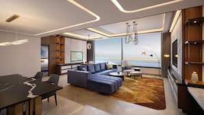 A modern living room with a large sofa, a dining table, and a view of a body of water. - Inspire Entertainment Resort (Incheon)