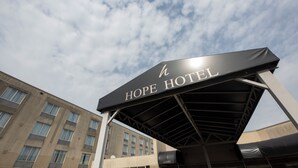 A hotel sign with "HOPE HOTEL" written on it. - Hope Hotel & Conference Center (Dayton)