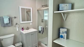 Shower, hair dryer, towels, soap