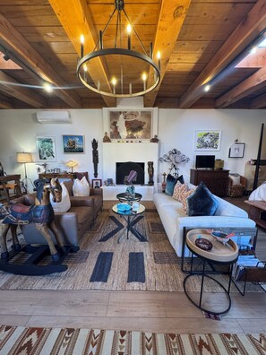 TV, fireplace - Chic Adobe Loft in Historic Hacienda, Guadalupe District, Scenic walk to Plaza (Santa Fe)
