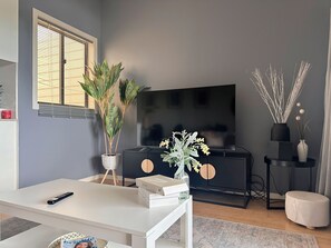 Living area - Modern 2BR Retreat | 5 min to CBD + Free Parking (Norman Park)