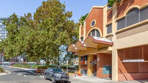 A building with a marquee sign reading "HIGHPOINT" and a sign indicating "RESIDENTIAL PARKING ONLY MAX HEIGHT 2.2 Meters." - Spacious 3-bed With Alfresco Dining by Amenities (Sydney)