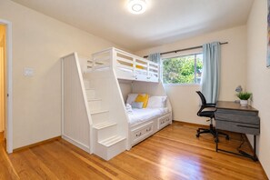 A bedroom with a bunk bed, a desk, and a chair. - Central 3BR Home - Steps from Mountain View DT, Castro St (Mountain View)