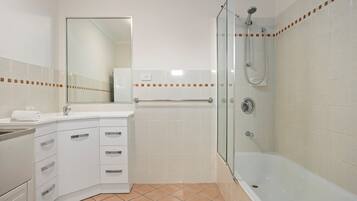 Apartment | Bathroom | Bathtub, hair dryer, towels, soap