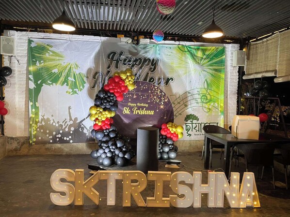 A decorated indoor space with a banner reading "Happy Birthday Sk Trishna" and a large illuminated sign spelling "SKTRISHNA". - Chayatol Resort & Restaurant Purbachal  (Rupganj)