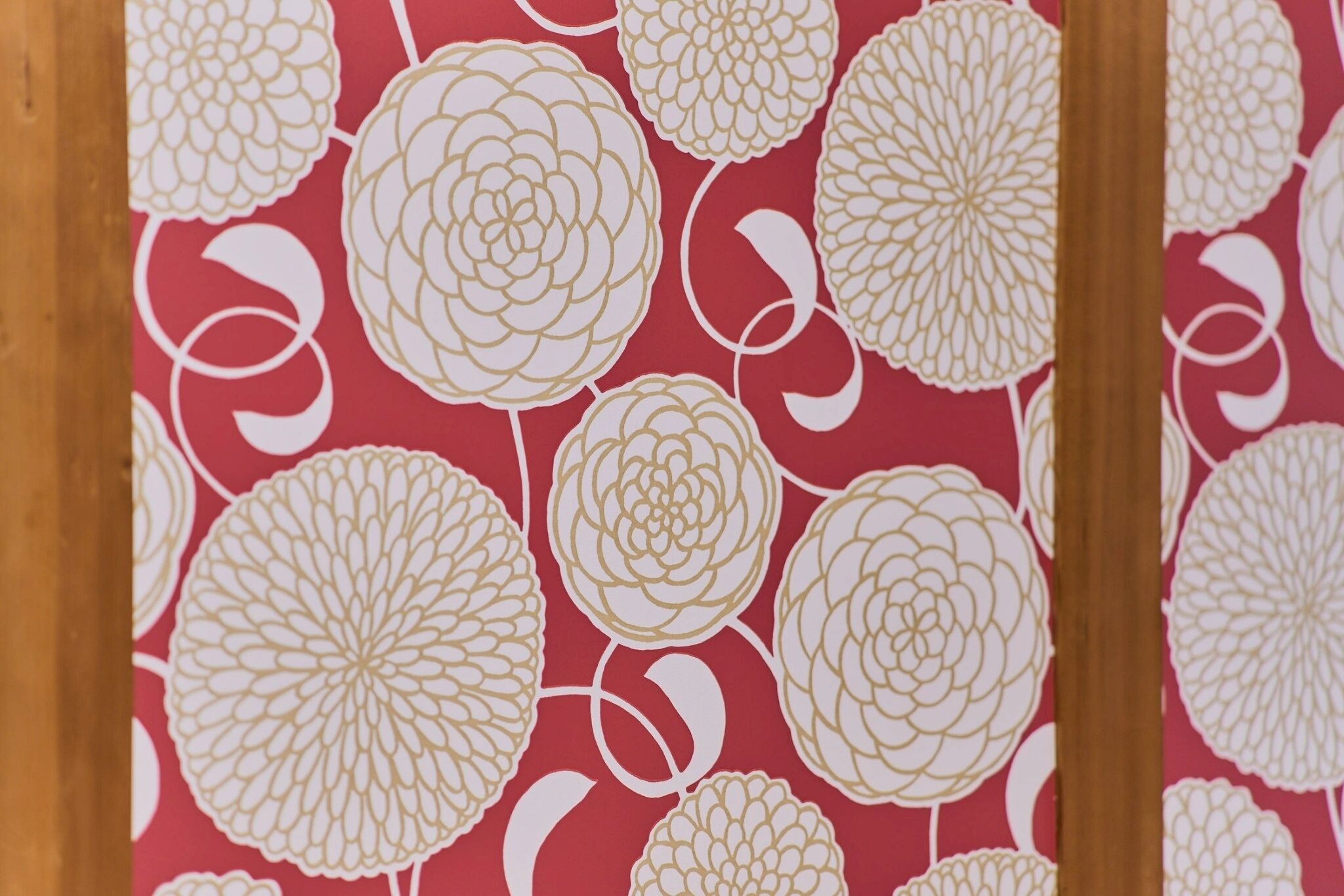 A close-up of a wallpaper with a floral pattern.