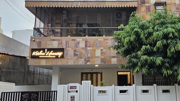 A building with a sign reading "Krishna House" and a gated entrance. - Krishna Homestay (Varanasi)
