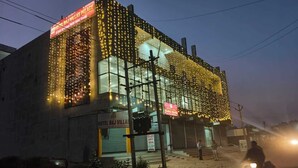 A building with multiple signs for Hotel Raj Villas, including a prominent sign on the facade. - Hotel Raj Villas Palace (Jodhpur)