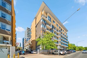 Exterior - Spacious Apartment with Gym & Pool Access (City)